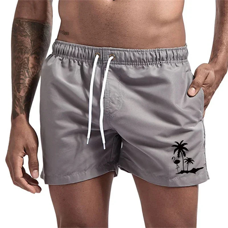 Pantalones cortos avec imprimé árbol de coco et flamenco para hombre, pantalons cortos de playa informales de verano, bañado